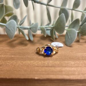 Gold CZ Ring with Deep Blue Gemstone